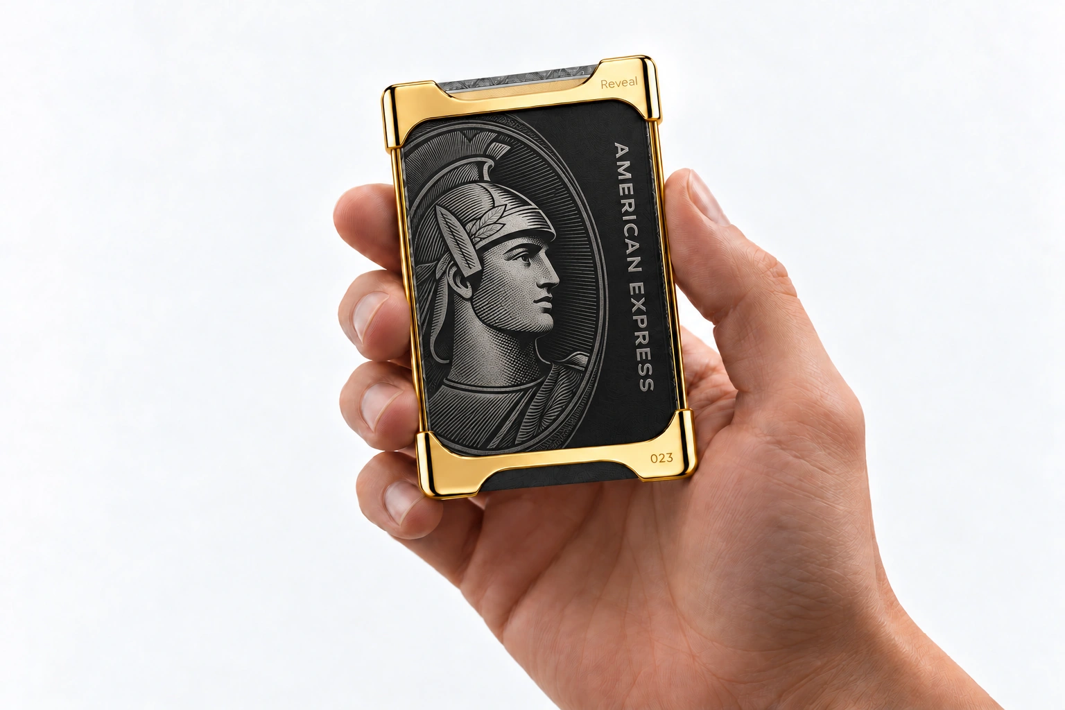Yellow Gold Reveal Wallet, numbered 023, framing a black Centurion card in a hand